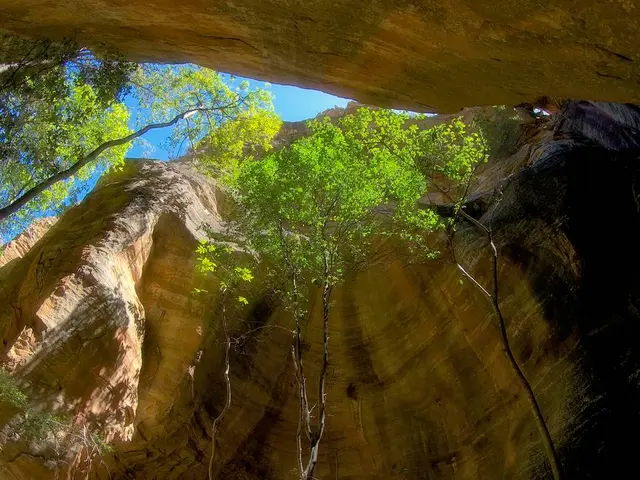 Unveiling a Cave Offering Awe-Inspiring Scenic Vistas of a Lake and Mountains in Chechnya